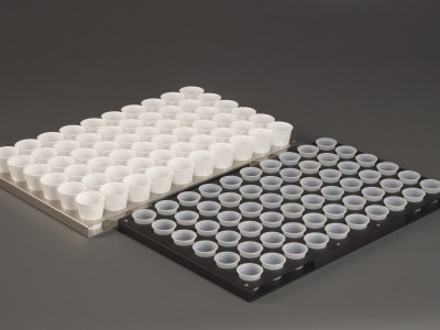 Trays custom designed for two different sample cup sizes.